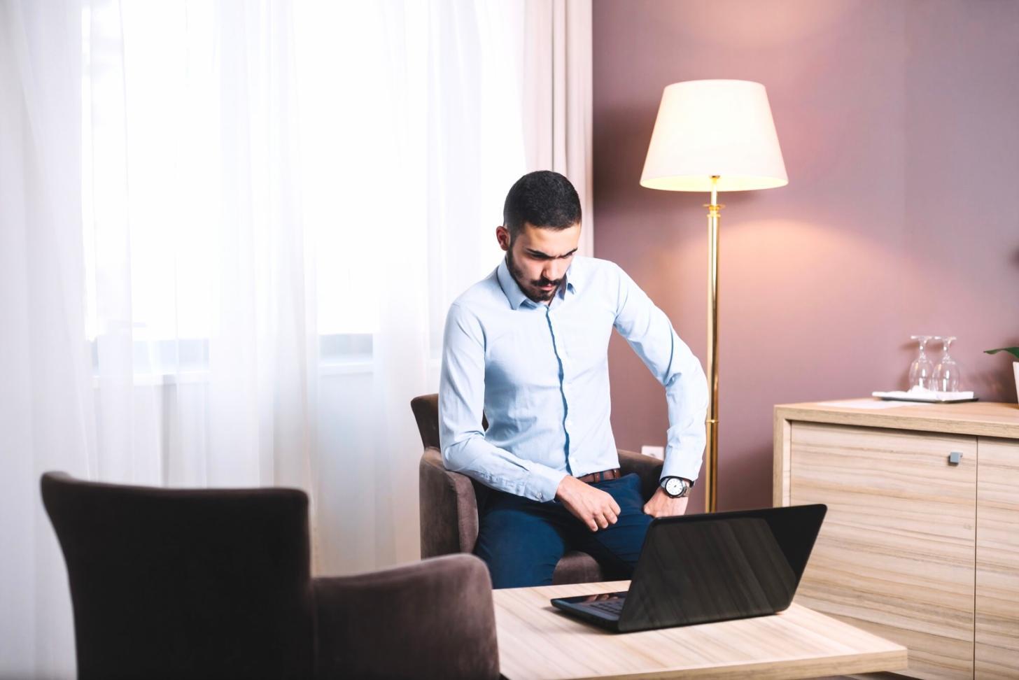 Financial analyst reviewing company statements with detailed notes and calculations